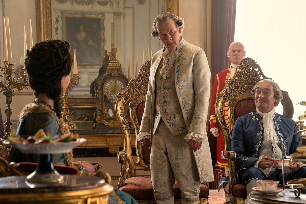 Richard Cunningham as Lord Bute (center) in Season 1 of Queen Charlotte.