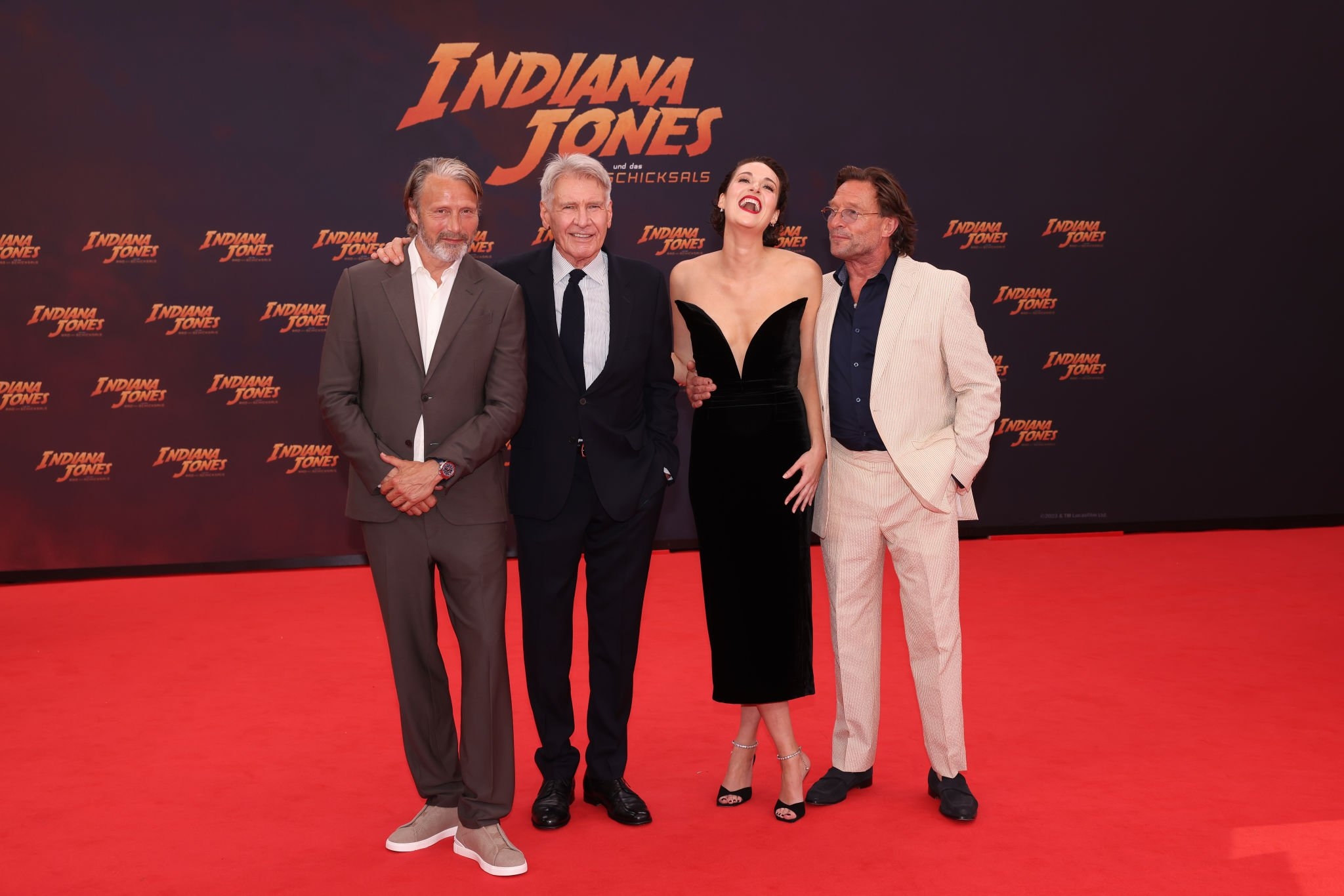 Mads Mikkelsen, Thomas Kretschmann, Phoebe Waller-Bridge and Harrison Ford attend the premiere of "Indiana Jones und das Rad des Schicksals" at Zoo Palast on June 22, 2023 in Berlin, Germany. 