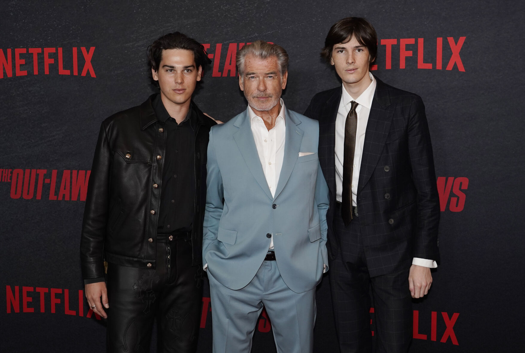 Pierce Brosnan, poses with his sons Paris, left, and Dylan