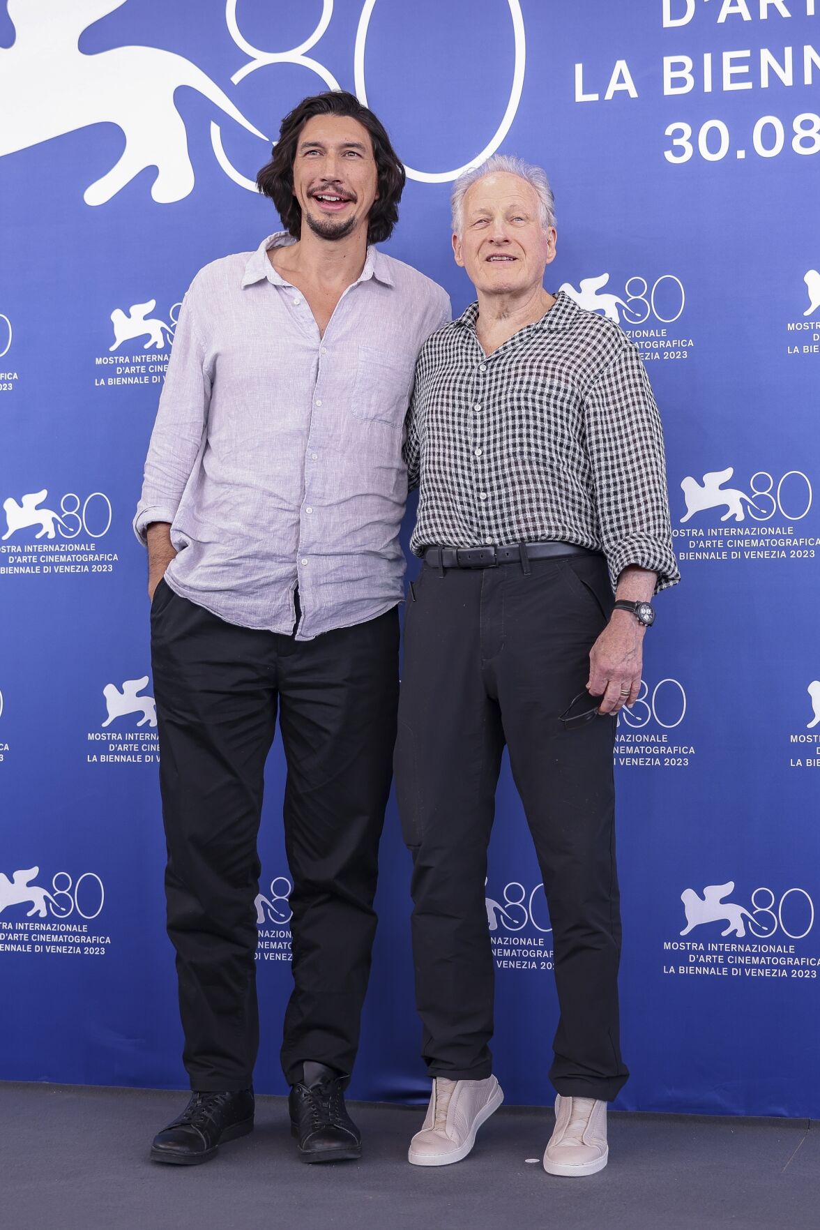 Adam Driver and director Michael Mann attend a photocall for the movie "Ferrari" at the 80th Venice International Film Festival on August 31, 2023 in Venice, Italy. 